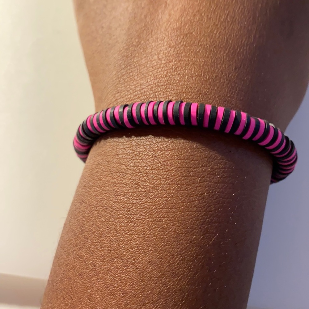 pink and black bracelet
